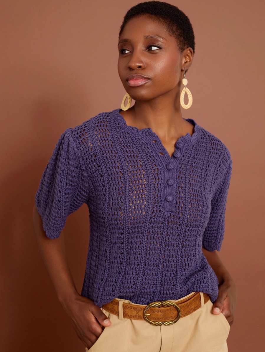 Crochet openwork jumper with ruffled sleeves and buttons